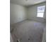 Unfinished bedroom with a window, offering a blank canvas at 3171 Cup Dr, Lakeland, FL 33803