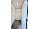 Open door to a walk-in closet with wire shelves, ready for organization at 3171 Cup Dr, Lakeland, FL 33803