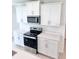 Well-equipped kitchen with white cabinets, stainless steel appliances, and quartz countertops at 3171 Cup Dr, Lakeland, FL 33803
