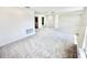 Spacious living room with new carpet and neutral colored walls that provides plenty of natural light at 3171 Cup Dr, Lakeland, FL 33803
