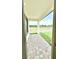 Covered patio with pavers overlooking a lush green space at 3171 Cup Dr, Lakeland, FL 33803