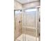 Modern tiled walk-in shower with sleek glass door and chrome fixtures at 3171 Cup Dr, Lakeland, FL 33803