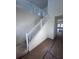 Bright staircase leading to the second floor with white railings at 3171 Cup Dr, Lakeland, FL 33803