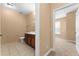 Bathroom featuring a white toilet, vanity, and tiled flooring at 3176 Feltrim Pl # 205, Kissimmee, FL 34747
