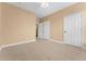Bedroom featuring neutral walls, plush carpet, and closet at 3176 Feltrim Pl # 205, Kissimmee, FL 34747