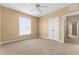 Bedroom featuring a closet, plush carpet, and a large window at 3176 Feltrim Pl # 205, Kissimmee, FL 34747