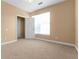 Bedroom featuring a storage closet, neutral walls and plush carpet at 3176 Feltrim Pl # 205, Kissimmee, FL 34747