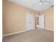 Bedroom with carpet, neutral walls, and a large closet at 3176 Feltrim Pl # 205, Kissimmee, FL 34747