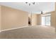 Bright living room with sliding glass doors and neutral carpet at 3176 Feltrim Pl # 205, Kissimmee, FL 34747