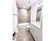 Clean bathroom featuring a tub and shower combo, tiled walls and vanity at 3225 Cup Dr, Lakeland, FL 33803