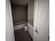 A clean bathroom with a tub and tiled walls at 3225 Cup Dr, Lakeland, FL 33803