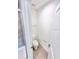 A bathroom with tiled floors, a toilet, and a shower with glass doors at 3225 Cup Dr, Lakeland, FL 33803