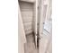 A view of a white shelving unit located in a bathroom with modern tiles and design at 3225 Cup Dr, Lakeland, FL 33803