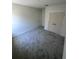 Bedroom featuring neutral paint and grey carpet at 3225 Cup Dr, Lakeland, FL 33803
