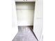Bright closet features carpet floors and shelving with an open door at 3225 Cup Dr, Lakeland, FL 33803