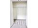 View of a bedroom closet featuring carpeted floor and a metal shelf for maximum storage at 3225 Cup Dr, Lakeland, FL 33803