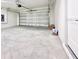 An empty two car garage with an automatic door opener, ready for your vehicles at 3225 Cup Dr, Lakeland, FL 33803