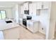 Modern kitchen featuring white cabinets, stainless steel appliances, and a quartz countertop at 3225 Cup Dr, Lakeland, FL 33803