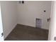 Functional laundry room with tile flooring and hookups for appliances at 3225 Cup Dr, Lakeland, FL 33803