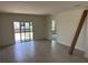 Bright living room featuring sliding glass doors and neutral paint at 3225 Cup Dr, Lakeland, FL 33803