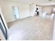 Open living space with bright tile floors connecting kitchen and living area at 3225 Cup Dr, Lakeland, FL 33803