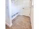 Bright mudroom featuring tile flooring, built-in shelving, and a convenient bench at 3225 Cup Dr, Lakeland, FL 33803