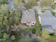 Aerial view of home's backyard, patio, and neighborhood showcasing the property's location at 325 Bellingrath Terrace, Deland, FL 32724