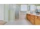 Bright bathroom featuring a glass enclosed shower and separate soaking tub at 325 Bellingrath Terrace, Deland, FL 32724