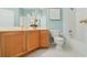 Bathroom featuring white tiles and a tub shower combination at 325 Bellingrath Terrace, Deland, FL 32724