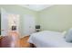 Bright bedroom with view of the hallway and double door closet with gold knobs at 325 Bellingrath Terrace, Deland, FL 32724