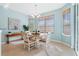 Dining area with large windows, a chandelier and table at 325 Bellingrath Terrace, Deland, FL 32724