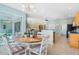 Eat-in area with large windows, a chandelier and table at 325 Bellingrath Terrace, Deland, FL 32724