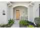 Inviting front porch featuring rocking chairs and decorative plants at 325 Bellingrath Terrace, Deland, FL 32724