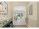 Open-concept living room showcasing tiled floors, neutral walls, and abundant natural light at 325 Bellingrath Terrace, Deland, FL 32724