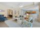 Open living room with a view into the kitchen and adjacent dining area at 325 Bellingrath Terrace, Deland, FL 32724