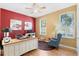 Bright office with wood floors, two windows and a ceiling fan at 325 Bellingrath Terrace, Deland, FL 32724