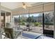 Relaxing screened patio with comfortable seating and a ceiling fan at 325 Bellingrath Terrace, Deland, FL 32724