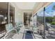 Screened patio with multiple seating areas and views of the backyard at 325 Bellingrath Terrace, Deland, FL 32724