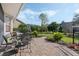 Charming brick patio featuring comfortable seating, perfect for outdoor relaxation and entertaining at 325 Bellingrath Terrace, Deland, FL 32724