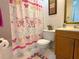 Bright bathroom with butterfly-themed shower curtain and vanity at 370 N Windmeadows St # 370, Altamonte Springs, FL 32701