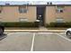 Neutral exterior of condo building with parking and stairs to units above the first floor at 370 N Windmeadows St # 370, Altamonte Springs, FL 32701