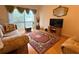 Cozy living room featuring a large window and hardwood flooring at 370 N Windmeadows St # 370, Altamonte Springs, FL 32701