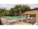 Community pool with plenty of shade and lounge chairs at 370 N Windmeadows St # 370, Altamonte Springs, FL 32701