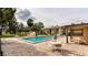 Community pool with brick deck, shaded seating and mature trees at 370 N Windmeadows St # 370, Altamonte Springs, FL 32701