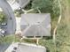 Bird's eye view showcasing roof of home with a sidewalk, mature landscaping, and trees at 466 Ashley Brooke Ct # C, Apopka, FL 32712