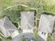 Aerial showcasing roof of home with sidewalk, mature landscaping and lush trees at 466 Ashley Brooke Ct # C, Apopka, FL 32712