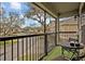 Relaxing balcony with synthetic turf and seating, overlooking a quiet neighborhood street at 466 Ashley Brooke Ct # C, Apopka, FL 32712