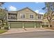 Attractive townhome featuring a three car garage, landscaped surroundings, and pleasant curb appeal at 466 Ashley Brooke Ct # C, Apopka, FL 32712