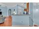 Open-concept kitchen with stainless steel fridge, and breakfast bar at 466 Ashley Brooke Ct # C, Apopka, FL 32712