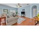 Inviting living room showcasing wood floors, comfortable seating, and natural light at 466 Ashley Brooke Ct # C, Apopka, FL 32712